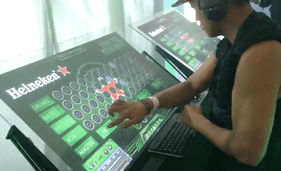 Shok Kreative emulator deployed at a Heineken brand activation, branded touchscreen grid lit up