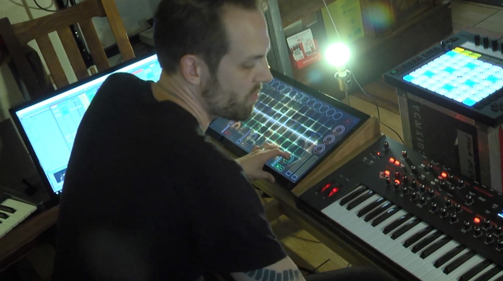 Tim Penner operating the Shok Kreative music-driven touchscreen interface in the studio