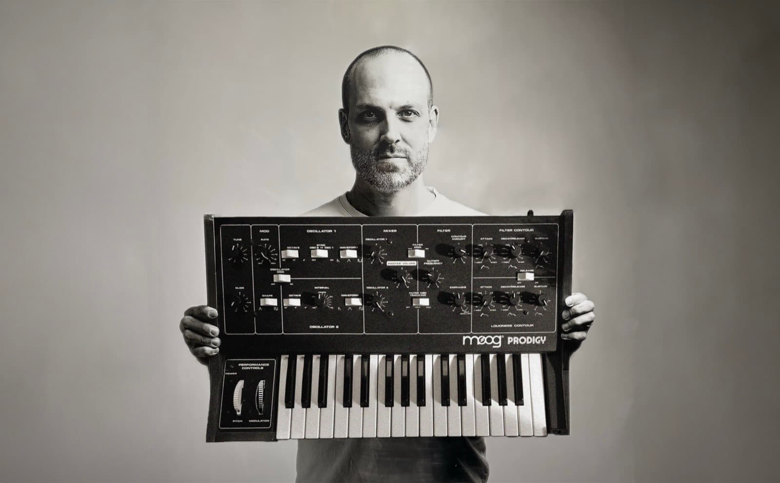 Tim Penner with a Moog Prodigy